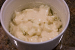 Layers of scalloped cauliflower with cheese and white sauce
