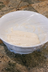 Re-cover the dough with plastic wrap after loosening it