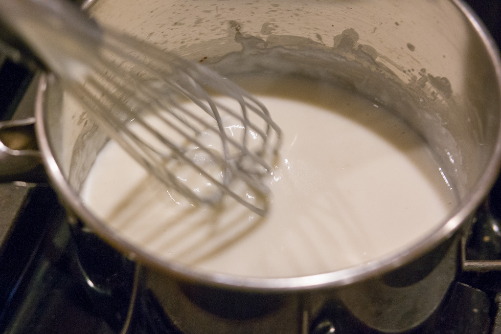 scalloped-cauliflower-recipe-0521 White sauce being whisked constantly