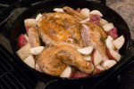 Spatchcock chicken, potatoes and garlic ready to go in the oven