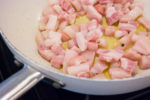Pancetta frying in olive oil
