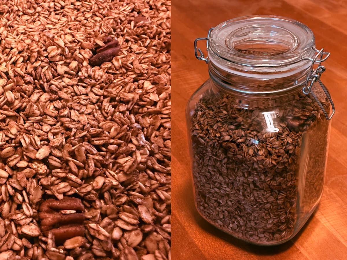 homemade cinnamon pecan granola on a baking sheet alongside the same granola stored in a glass clamp-lid jar